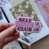 losse sticker in roze en rood met de tekst self love club