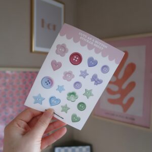 Stickervel met afbeeldingen van verschillende knopen in pastel tinten.